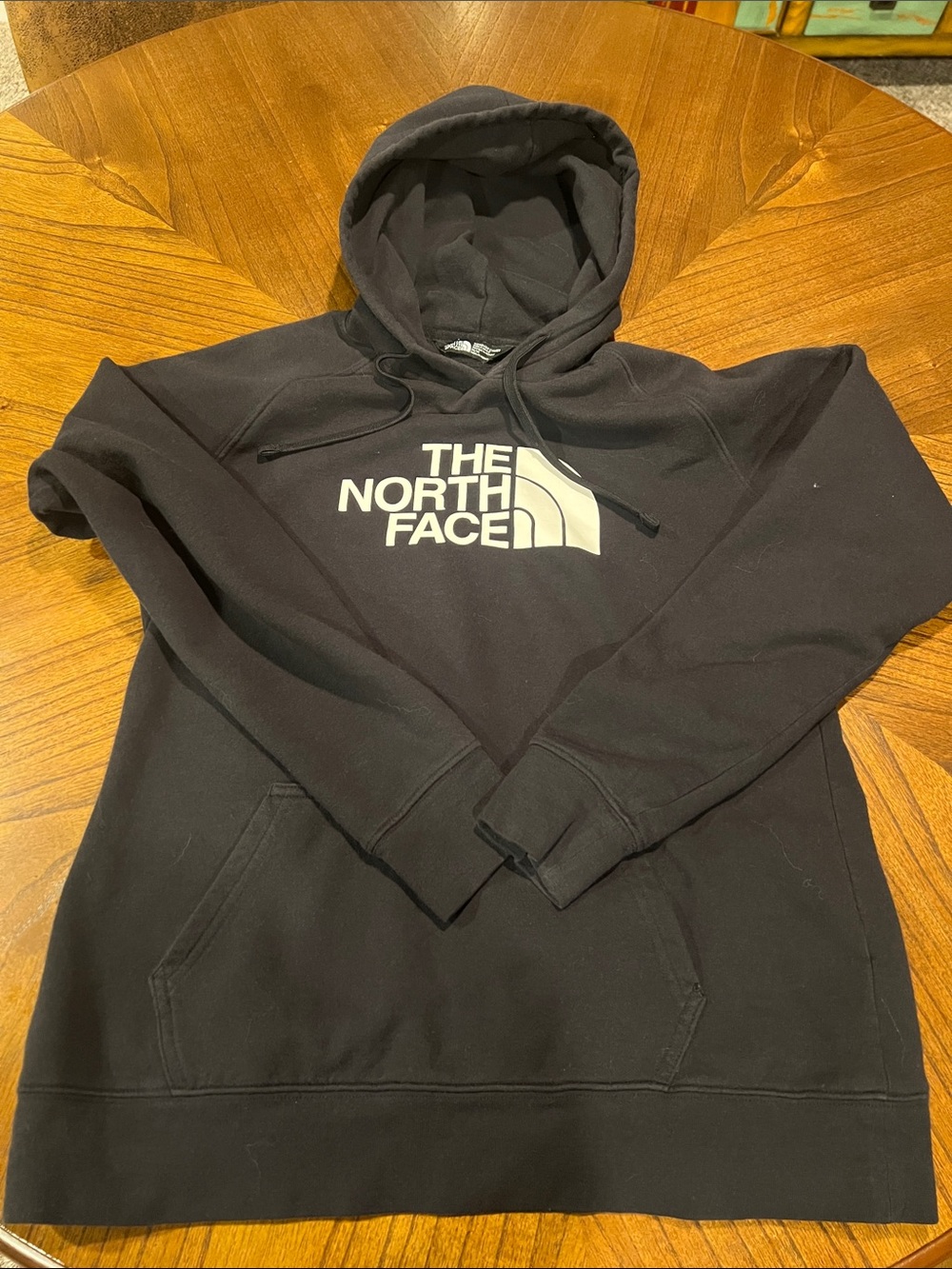 The North Face women’s Black Hoodie with White Logo
